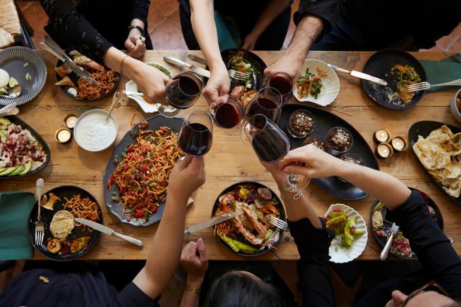 Family toasting with wine glasses at family reunion