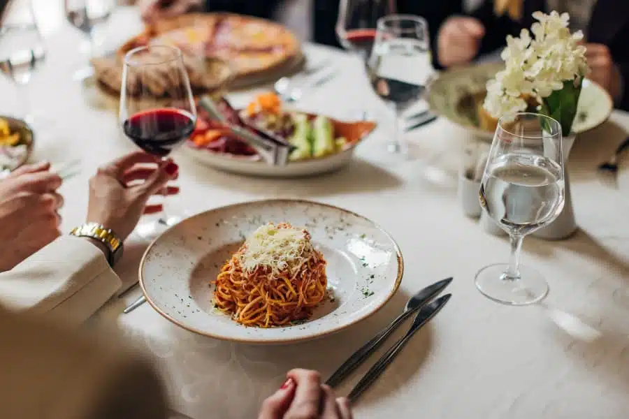 Italian meal with wine and water glasses
